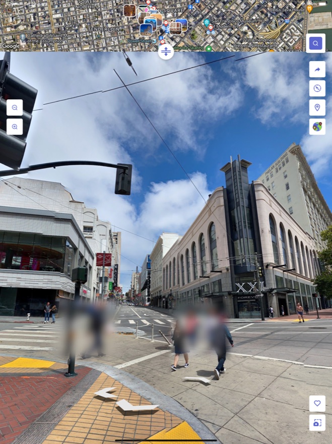 Street view at a busy intersection with mini map